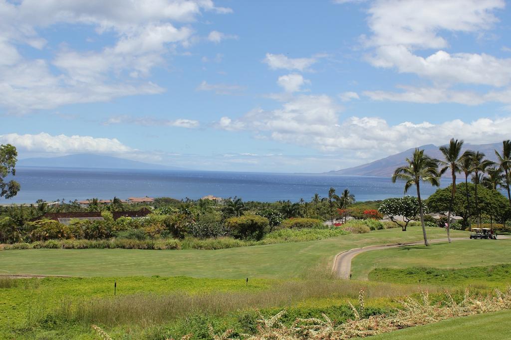 Golf cart paths, fairways, the Pacific Ocean and neighboring islands grace the landscape from Wailea Fairway Villas